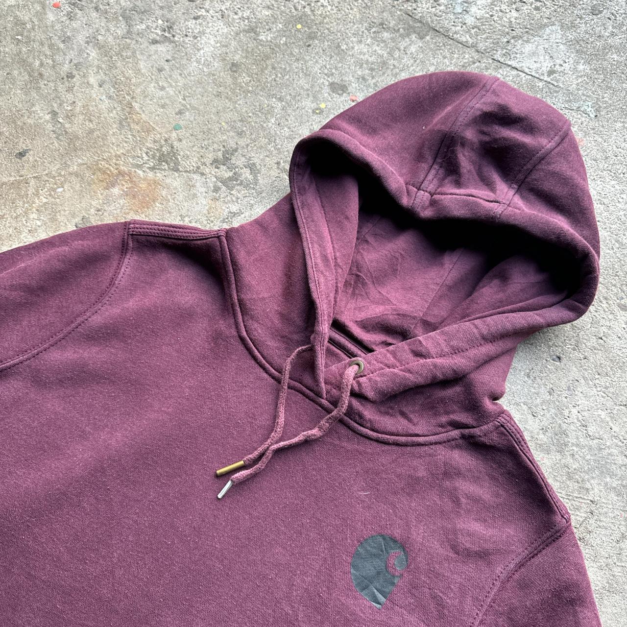 Burgundy Carhartt hoody with black print down the sleeve