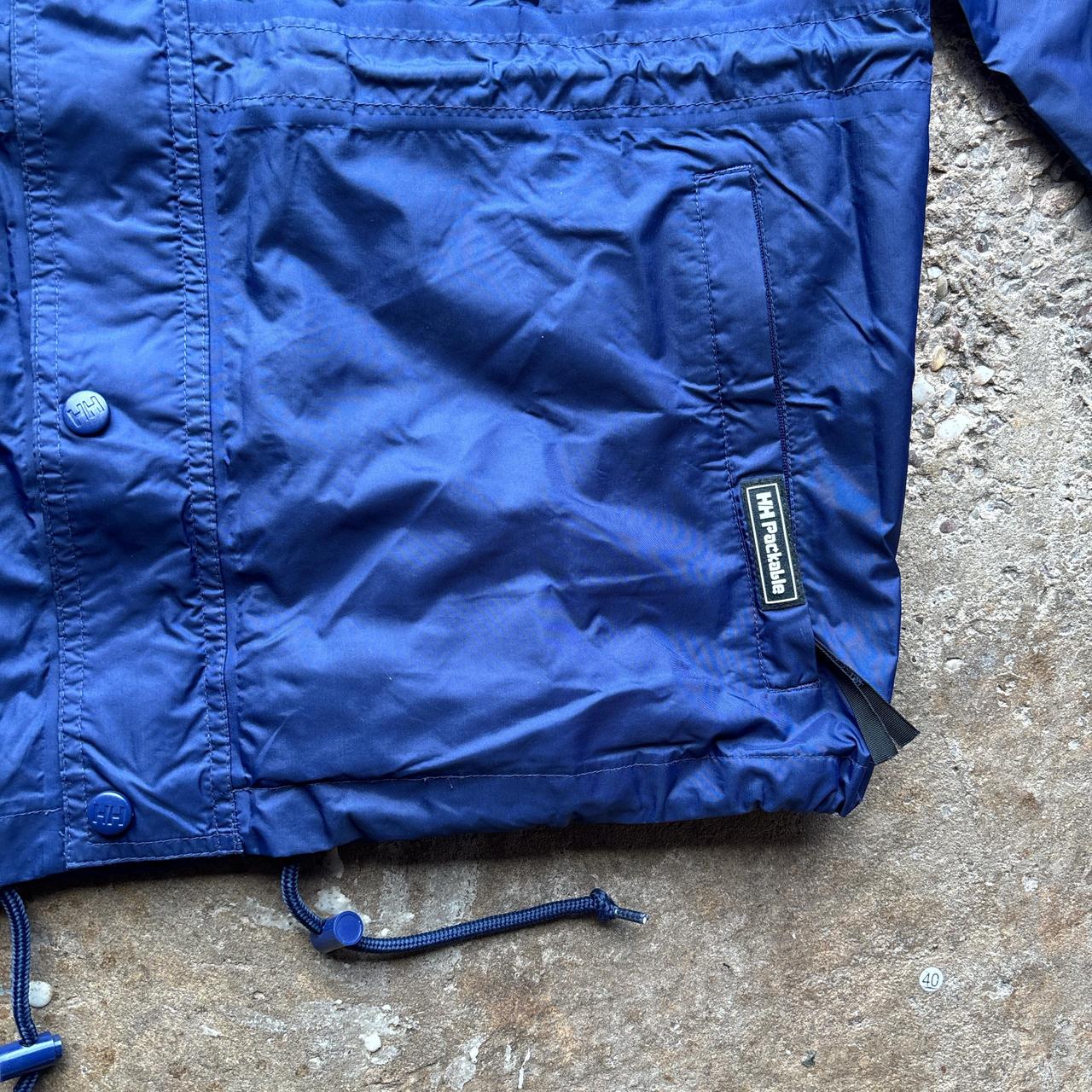 Blue vintage Helly Hansen lightweight windbreaker jacket