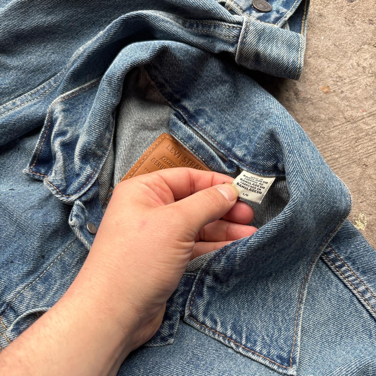 Blue Levi’s Trucker jacket with paint splats