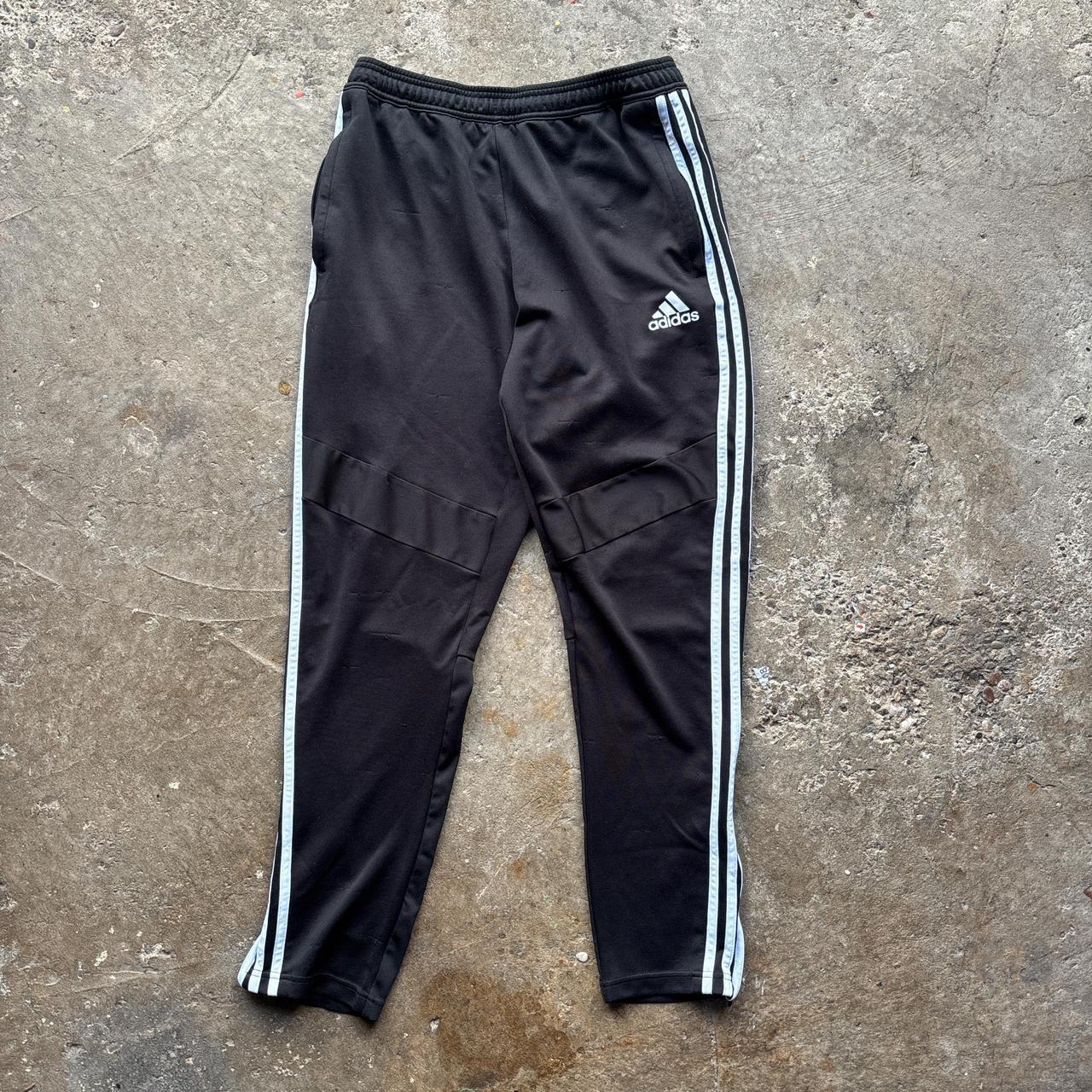 Black Adidas sweatpants with grey stripes and print logo