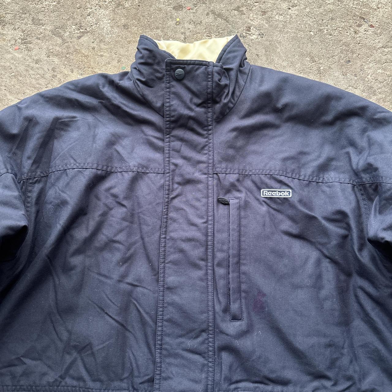 Navy and white Reebok puffer jacket