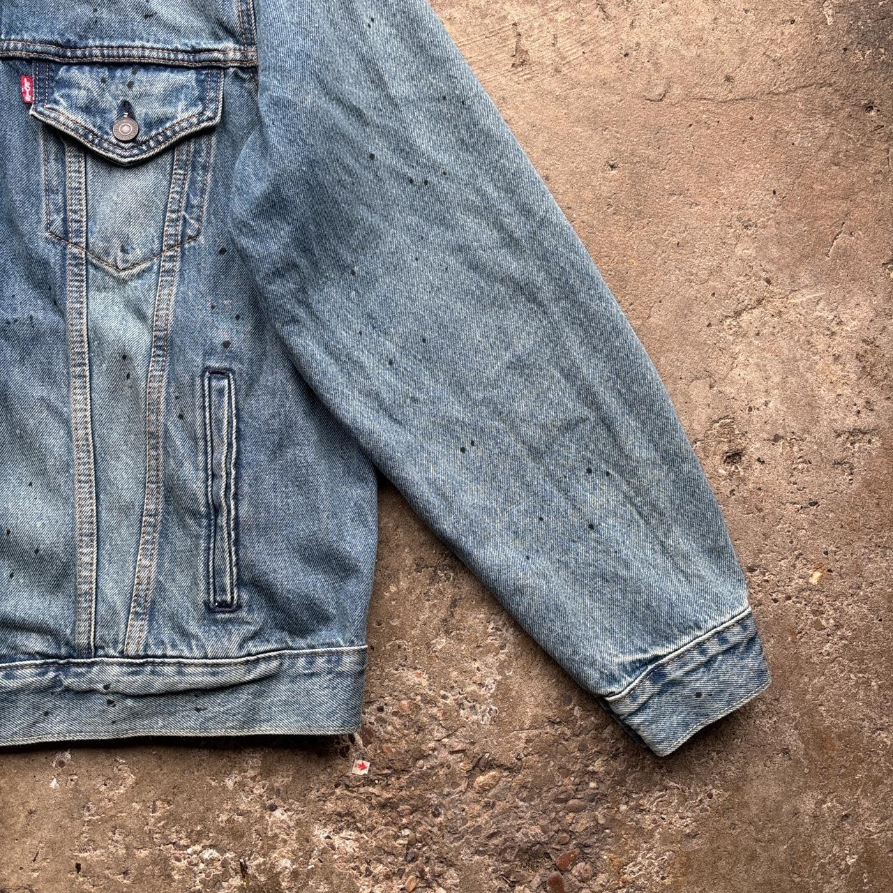 Blue Levi’s Trucker jacket with paint splats