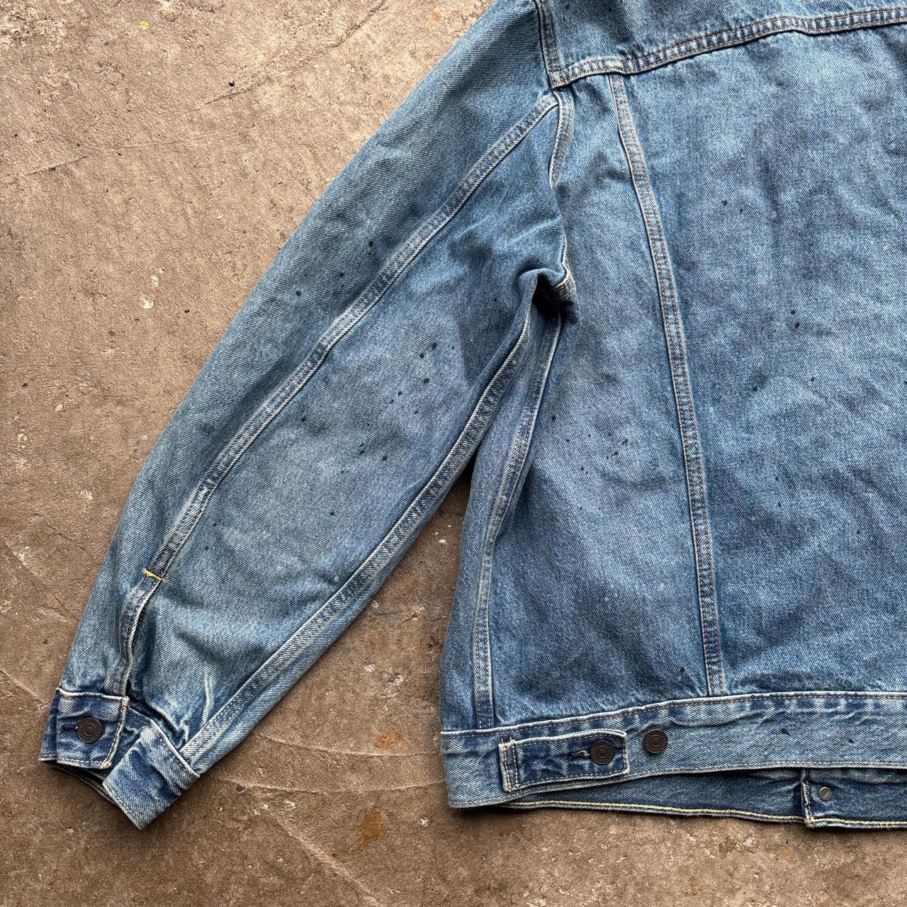Blue Levi’s Trucker jacket with paint splats