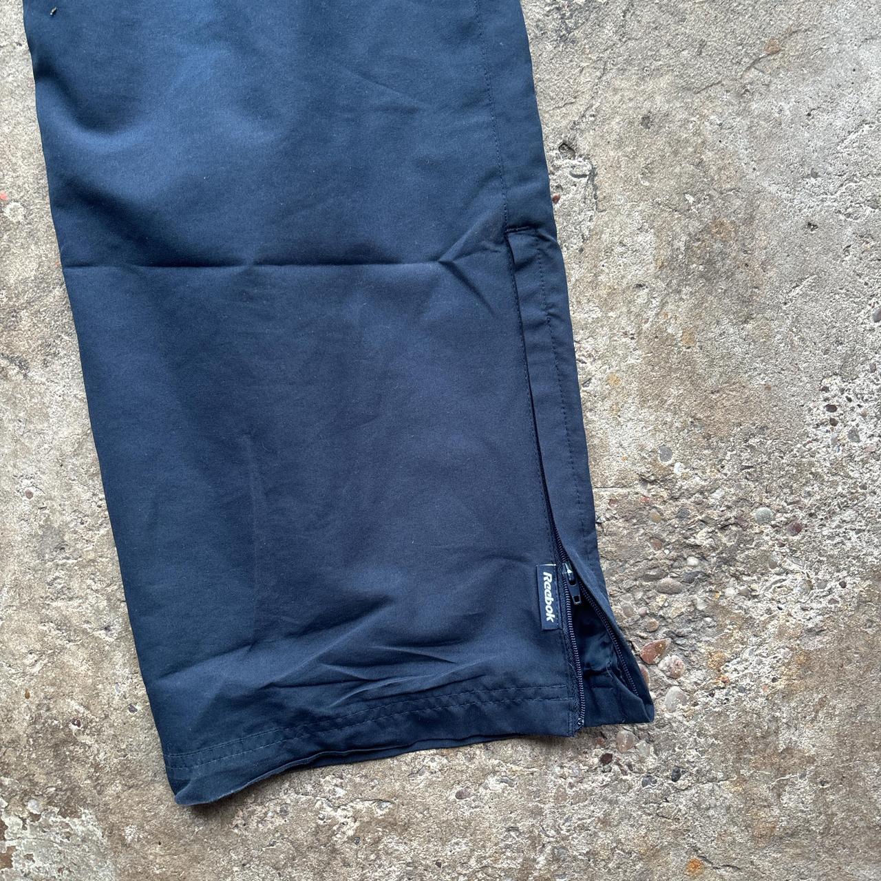 Navy blue Reebok sweatpants with embroidered logo