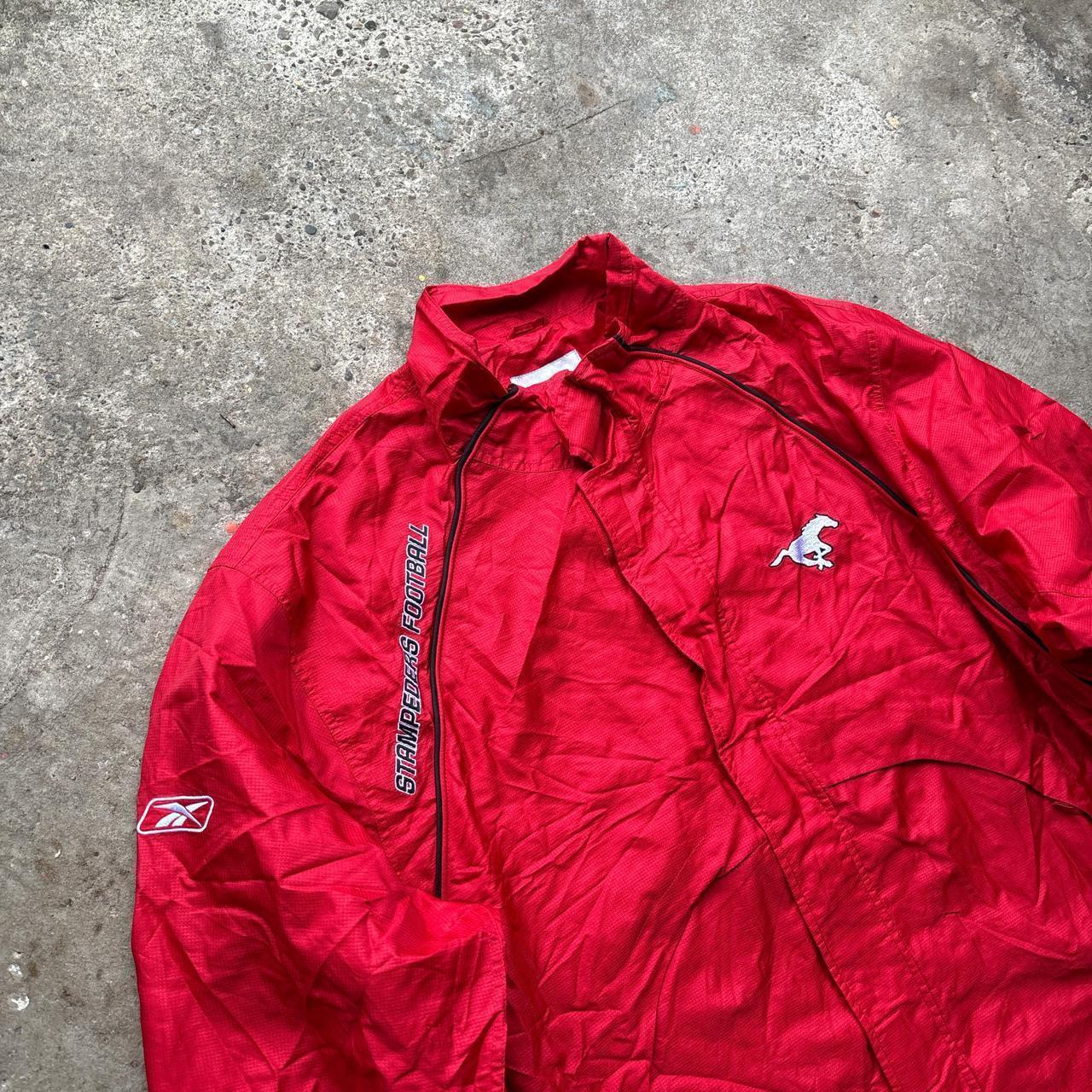 Red Reebok track jacket with embroidered logos