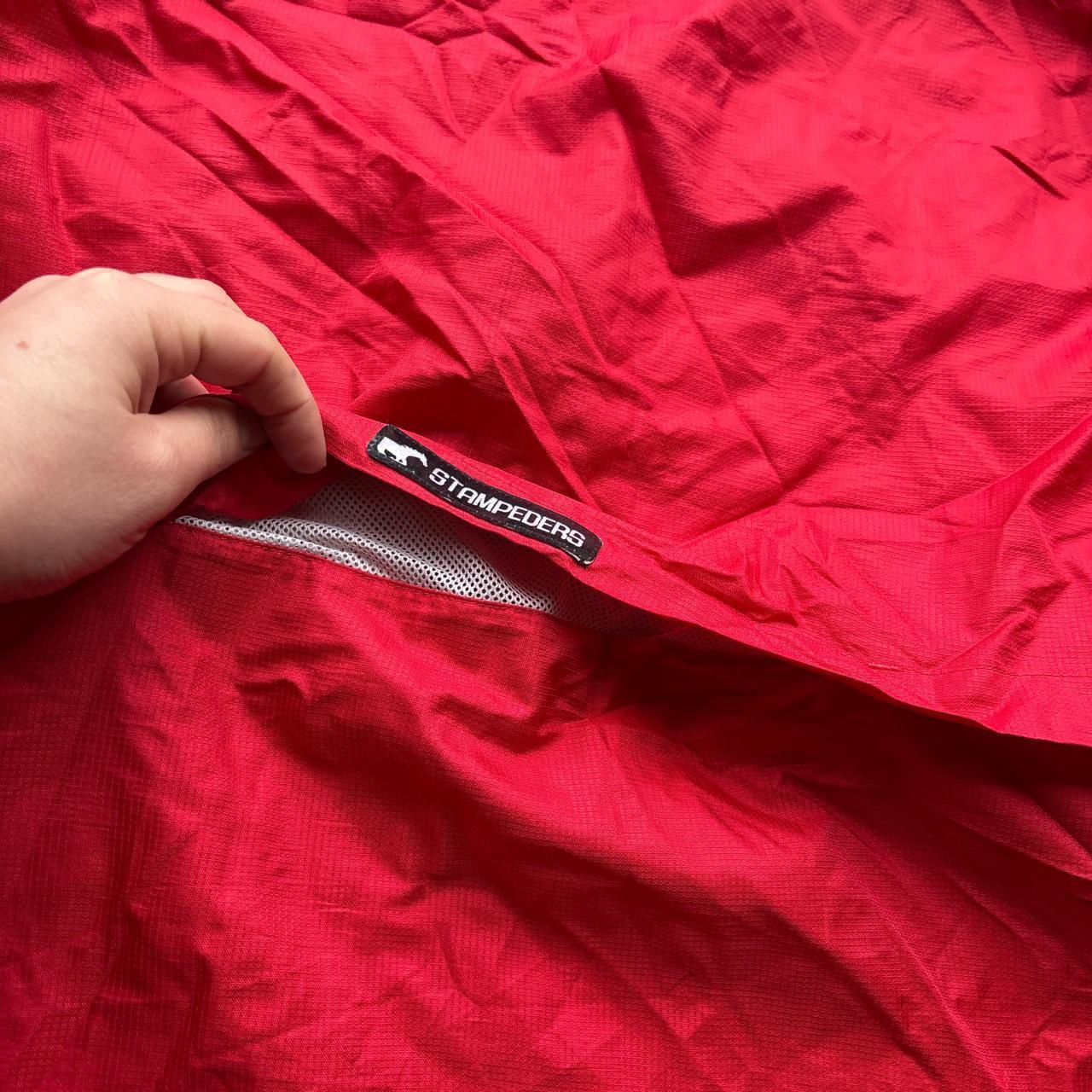 Red Reebok track jacket with embroidered logos