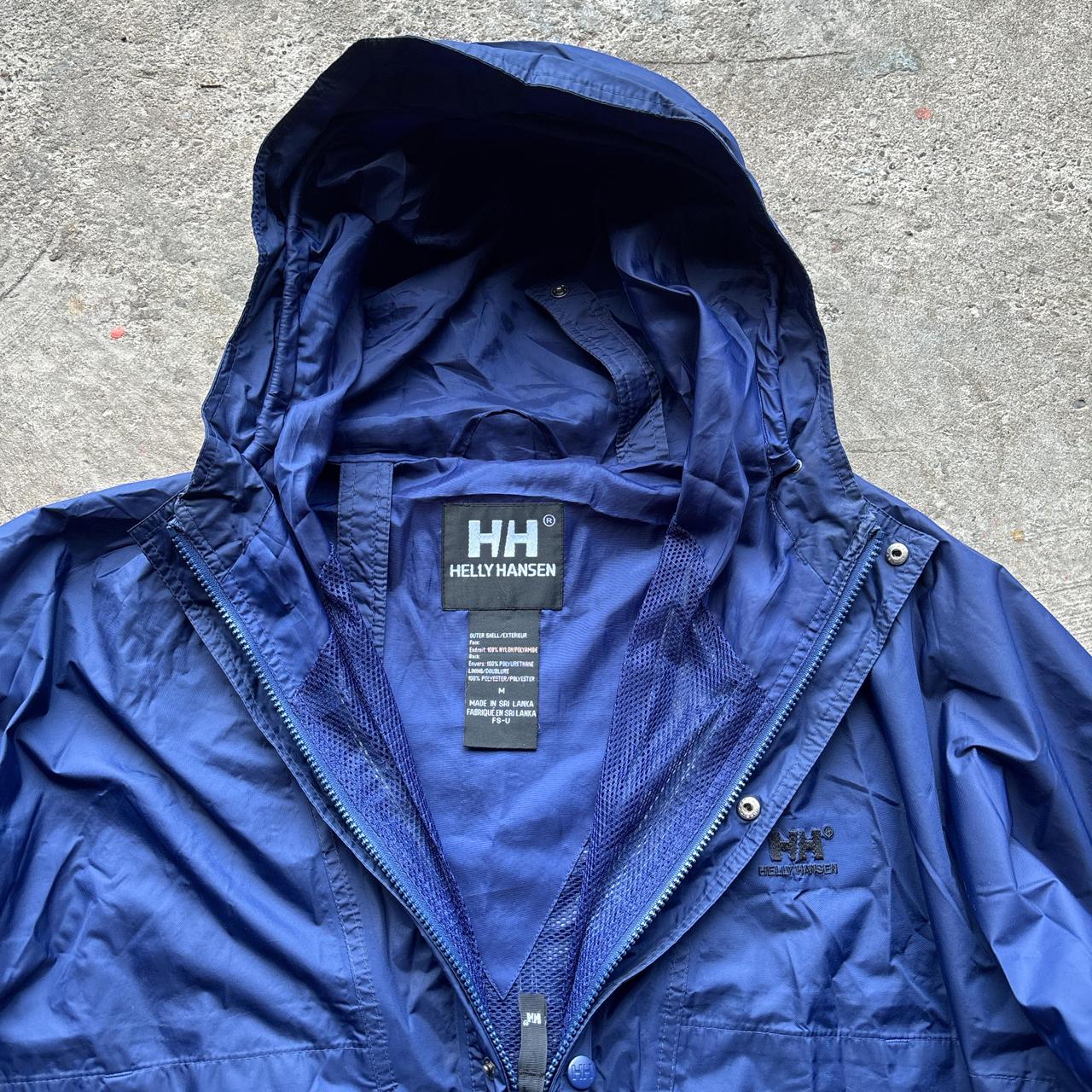 Blue vintage Helly Hansen lightweight windbreaker jacket