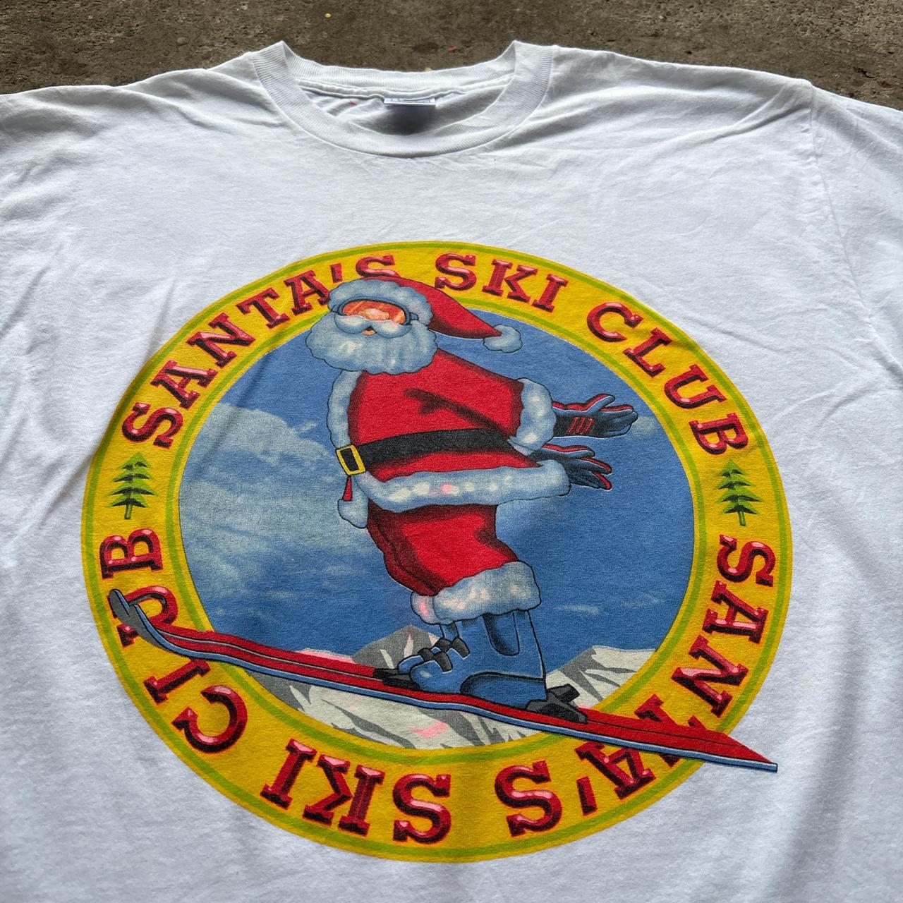 White graphic tee with ‘Santa Ski Club’ graphic