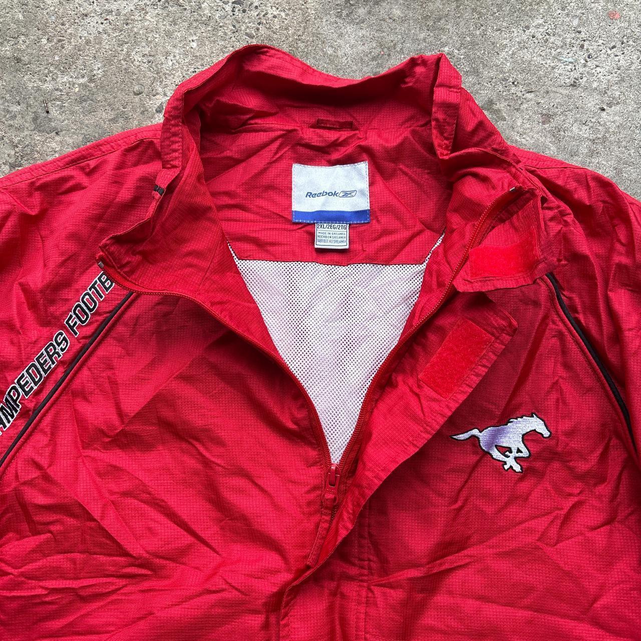 Red Reebok track jacket with embroidered logos