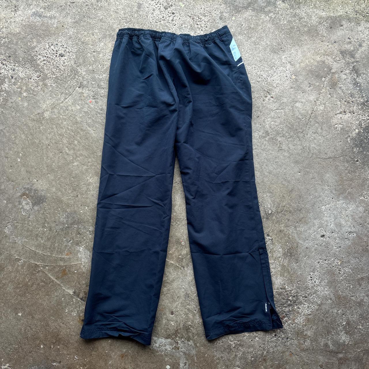 Navy blue Reebok sweatpants with embroidered logo