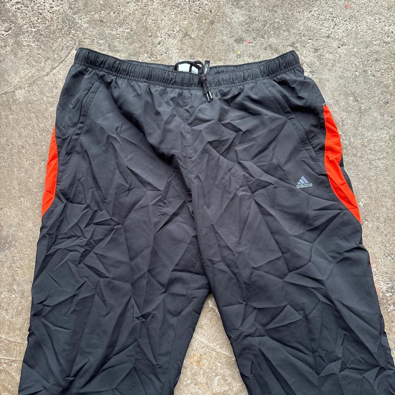 00s Black and orange Adidas track pants
