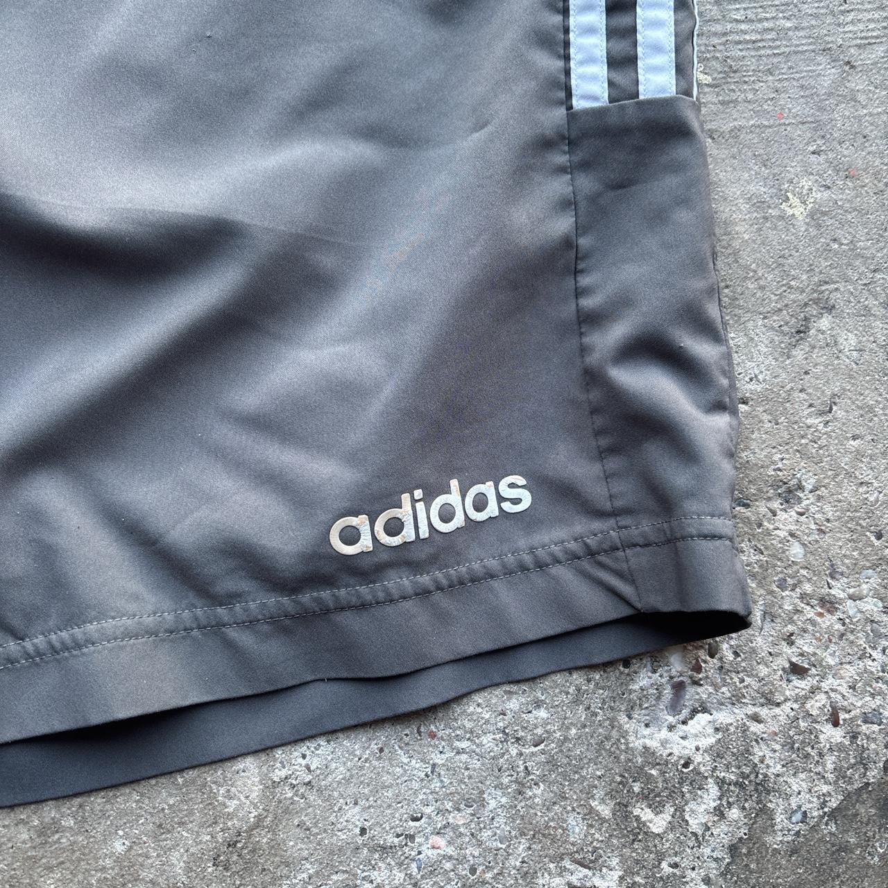 Grey Adidas active wear shorts with spell out logo