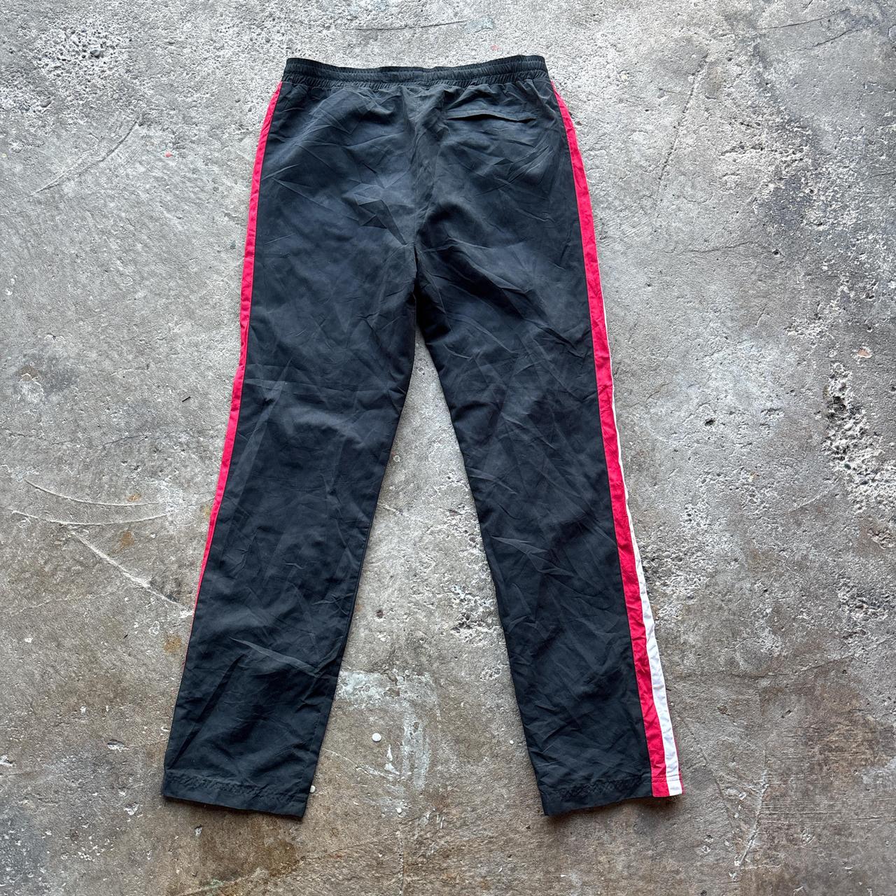 Black Nike Track pants with red and white stripes