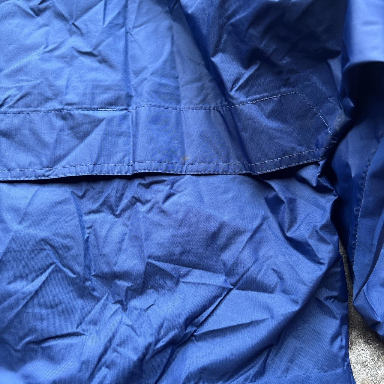 Blue vintage Helly Hansen lightweight windbreaker jacket