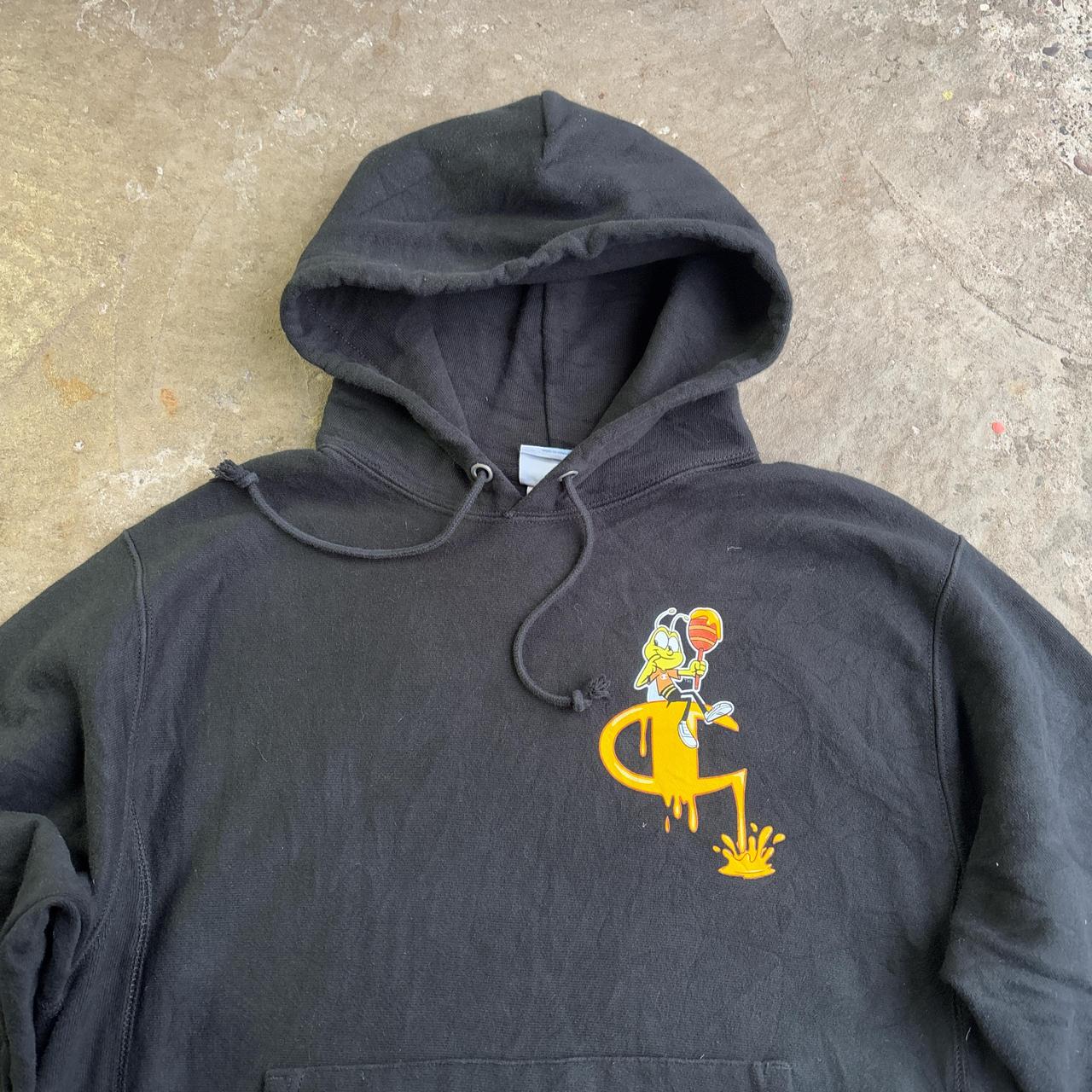 Black Champion hoodie with yellow Honey Nut design