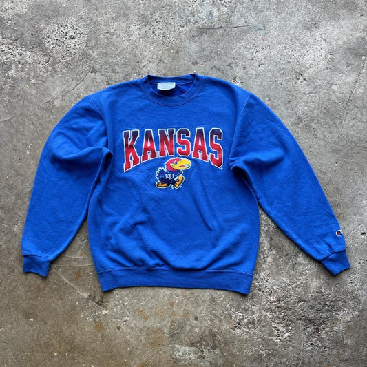 Blue Champion crewneck sweatshirt with  Kansas University logo