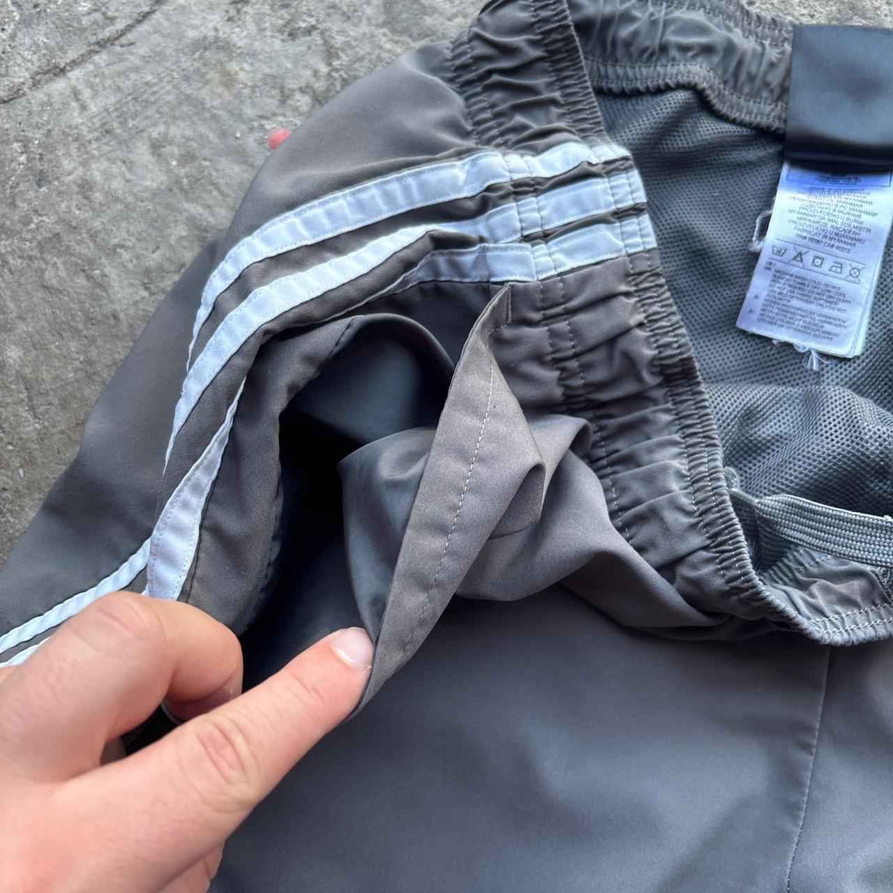 Grey Adidas active wear shorts with spell out logo