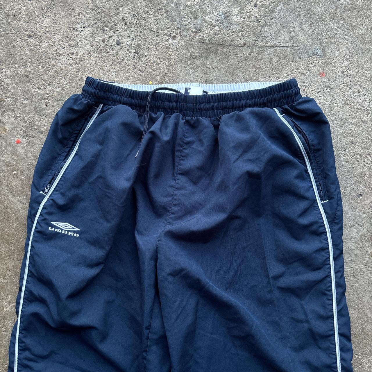 Navy Umbro joggers with white detailing