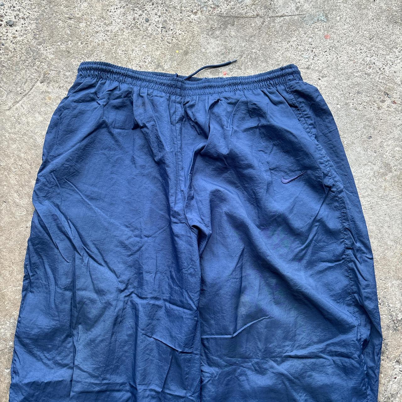 Navy Nike track pants with embroidered logo