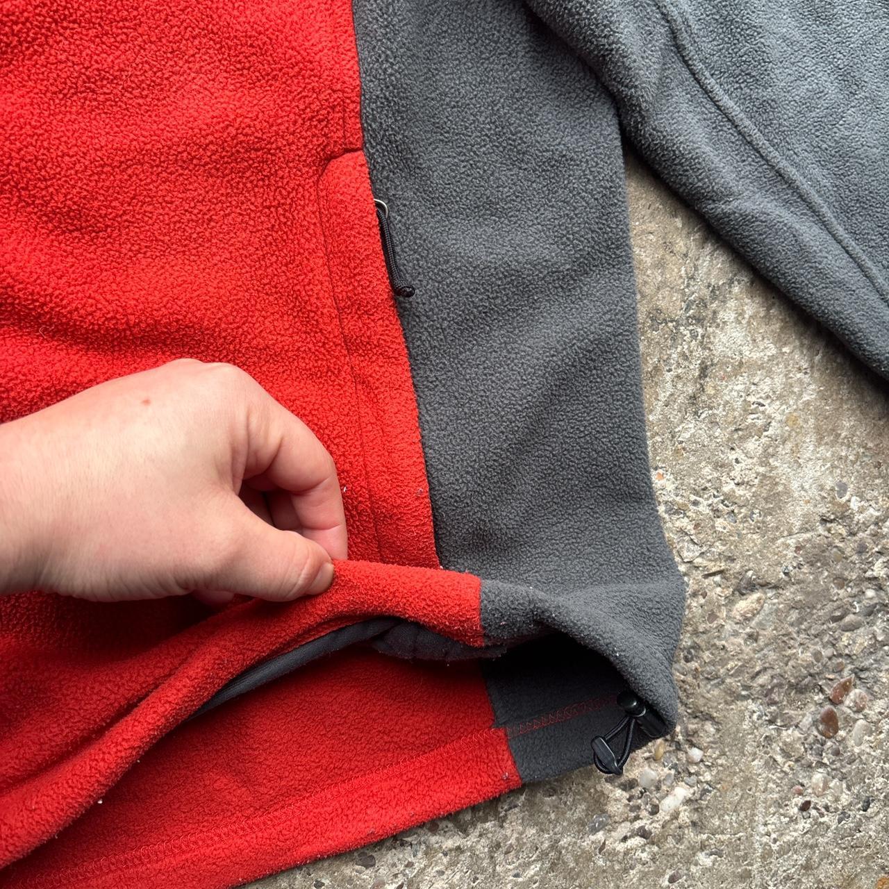 Red and grey The North Face zip-up fleece
