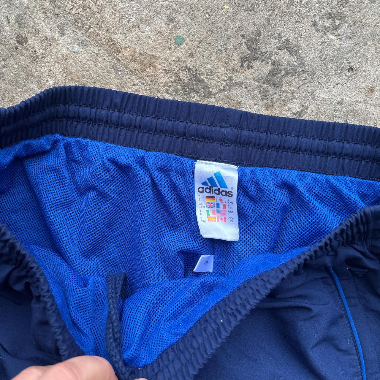 Navy Adidas track pants either blue detailing