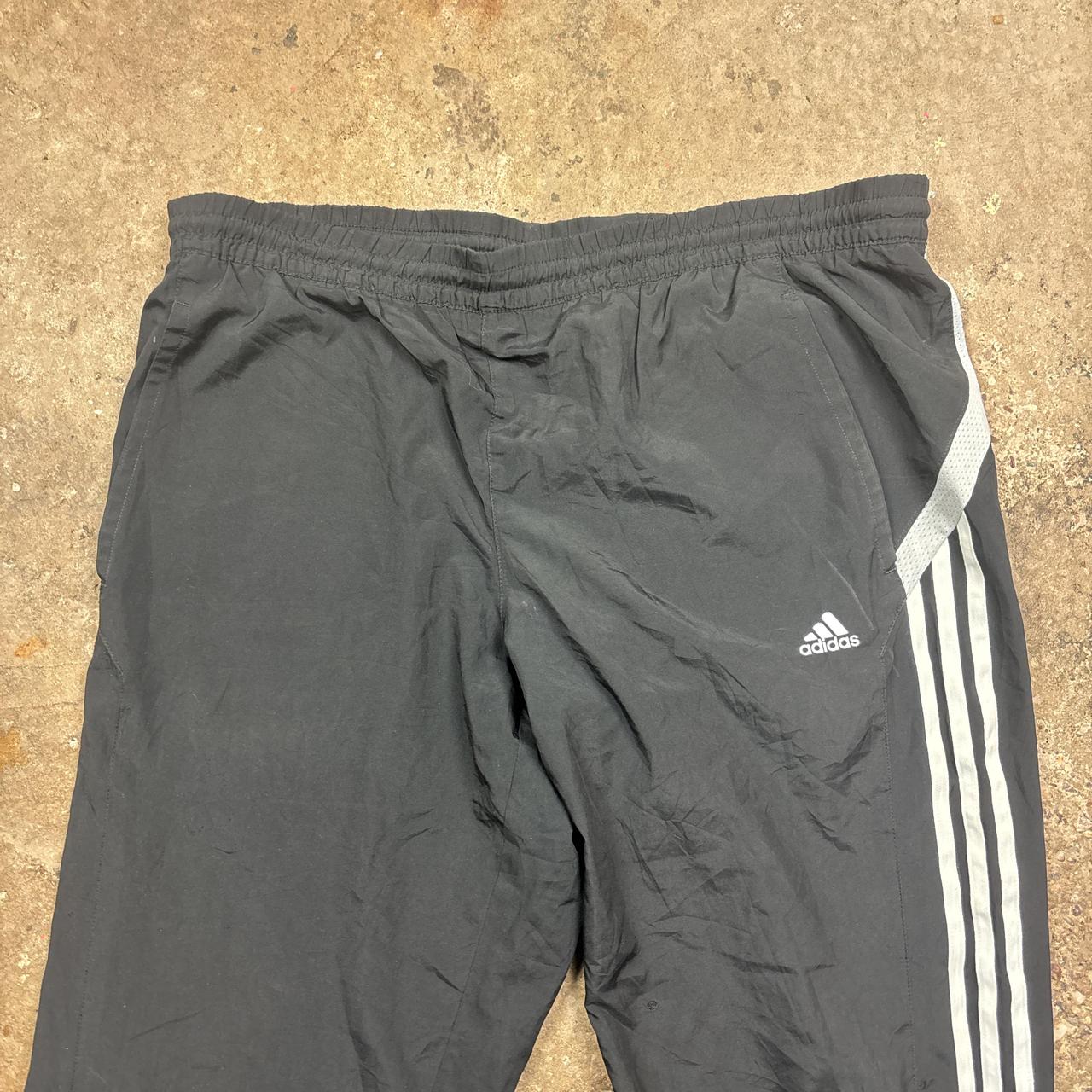 Black Adidas track pants