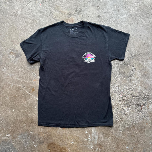 Black graphic tee with ‘it’s on the house’ graphic