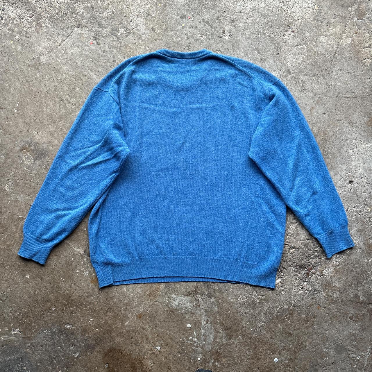 Blue wool jumper with Giant’s Causeway embroidered logo