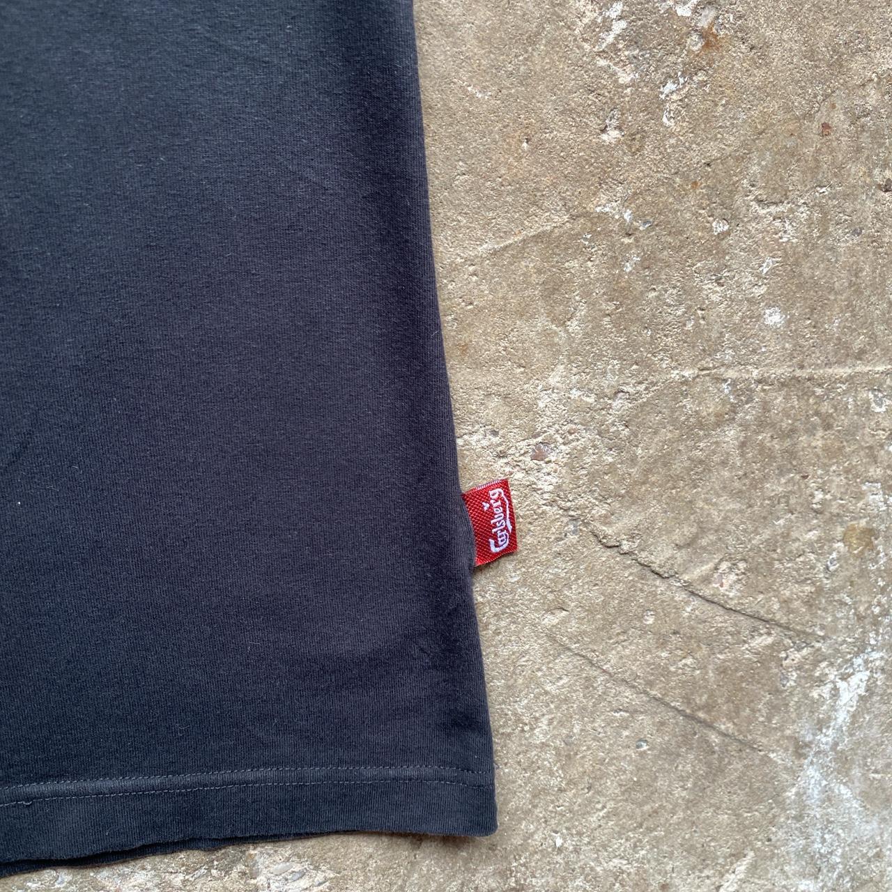 Black Carlsberg polo shirt with white tips