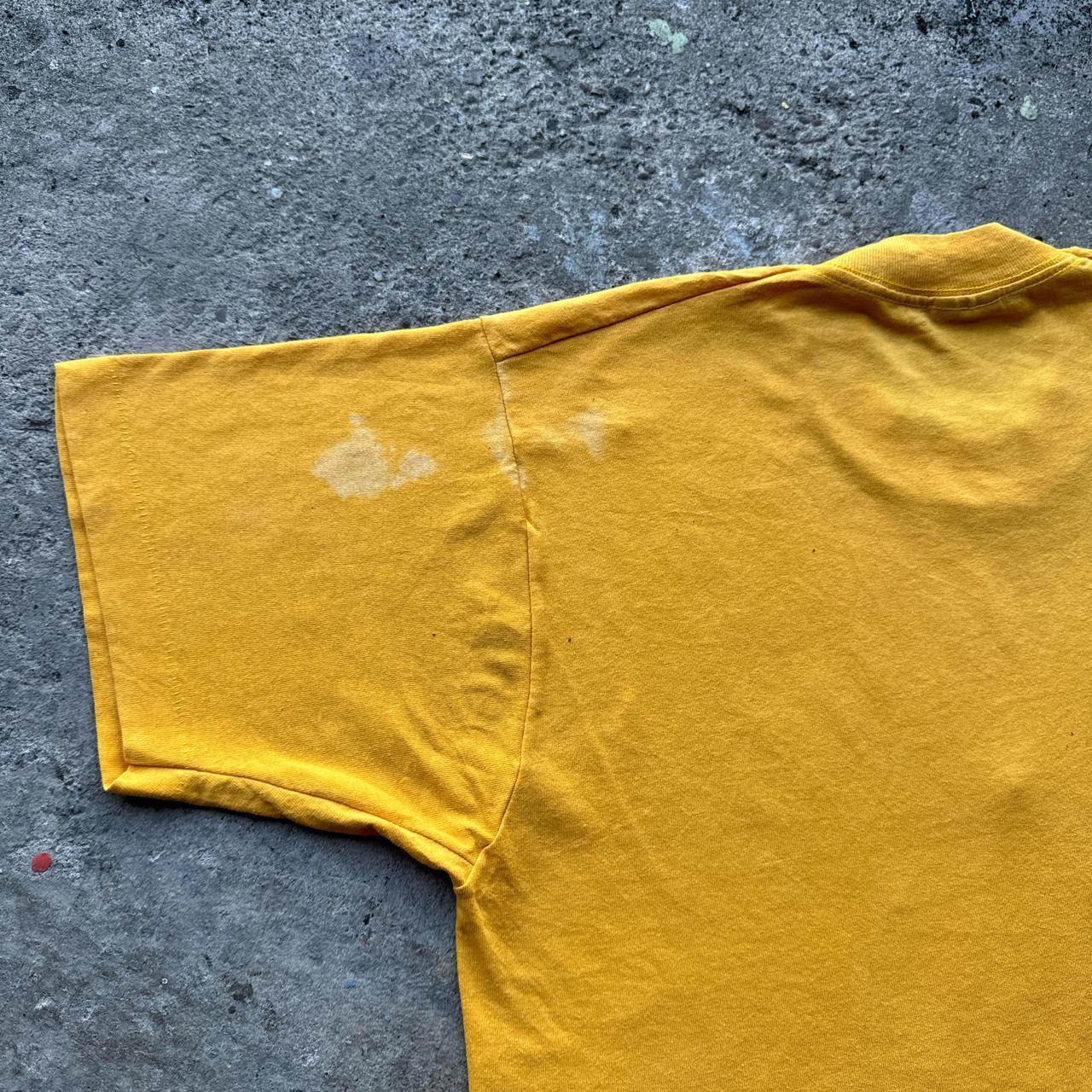Yellow graphic tee with Viking marching band graphic