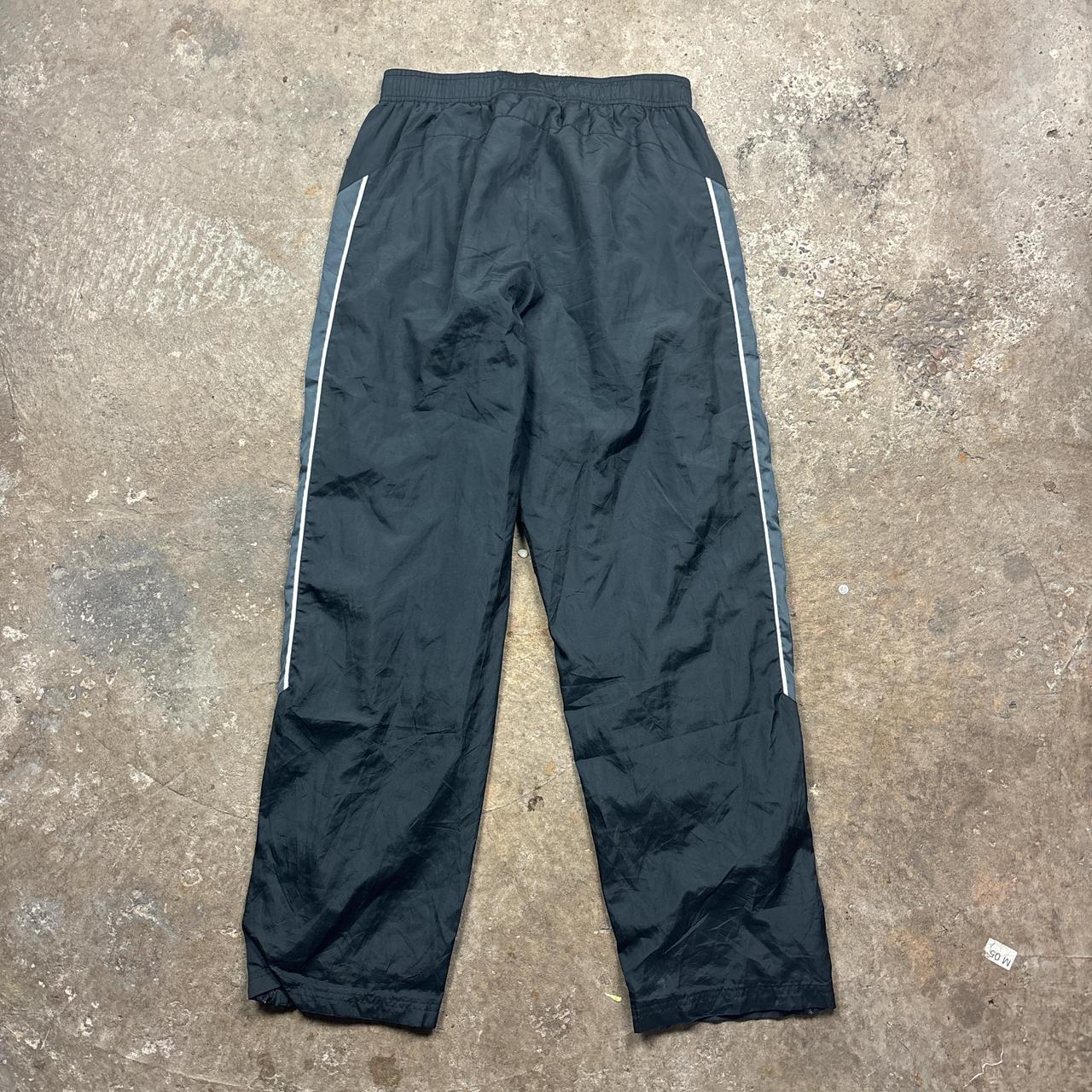 Black and grey Reebok track pants