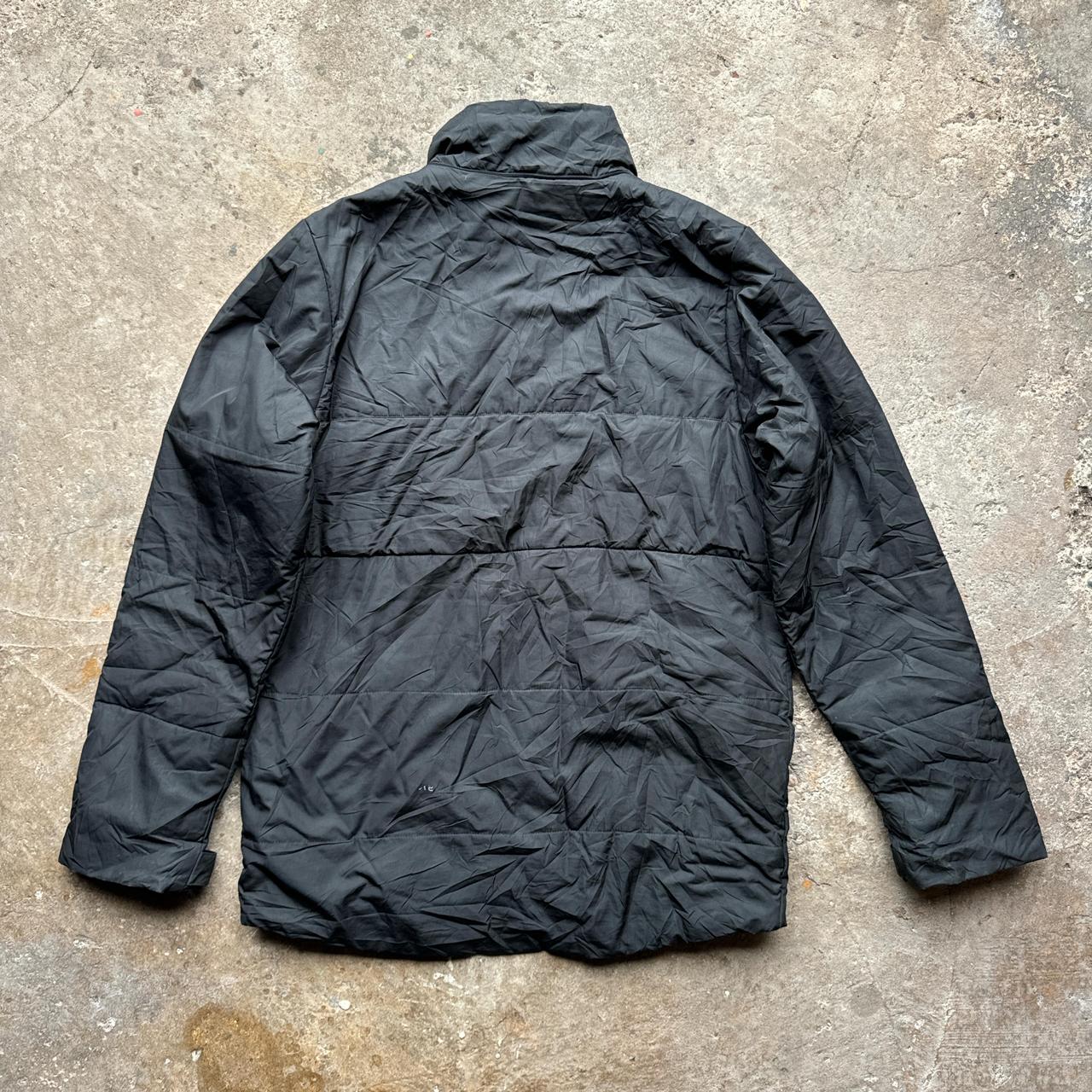 Black Nike puffer jacket with Transylvania Soccer embroidered logo