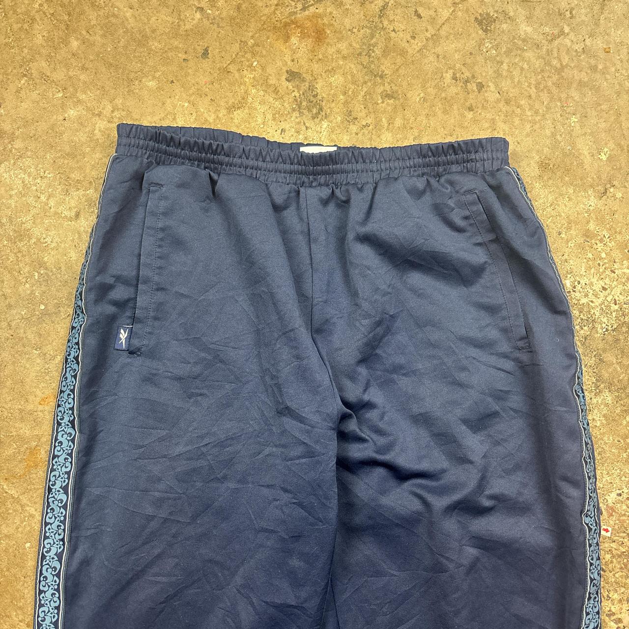 Vintage Blue Reebok track pants with embroidered logo and side stripe