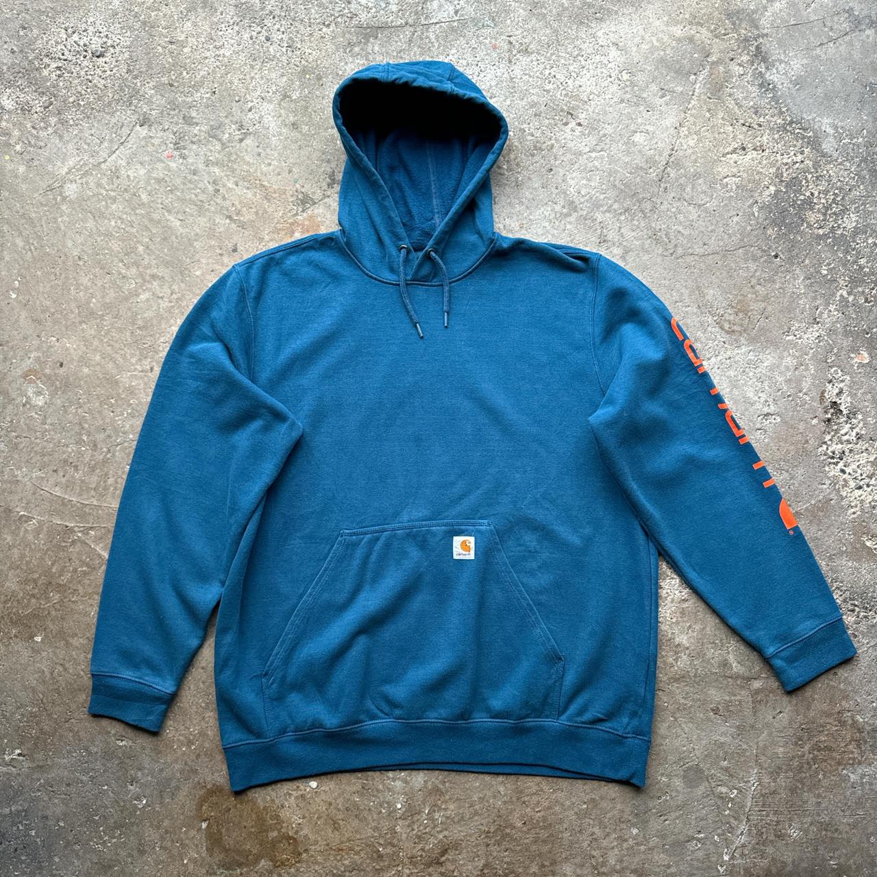 Blue Carhartt hoody with orange print down the sleeve
