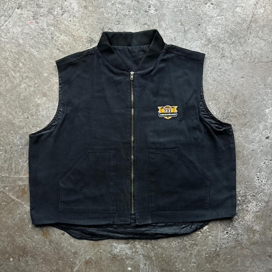 Black workwear body warmer with soft quilted lining and embroidered logo