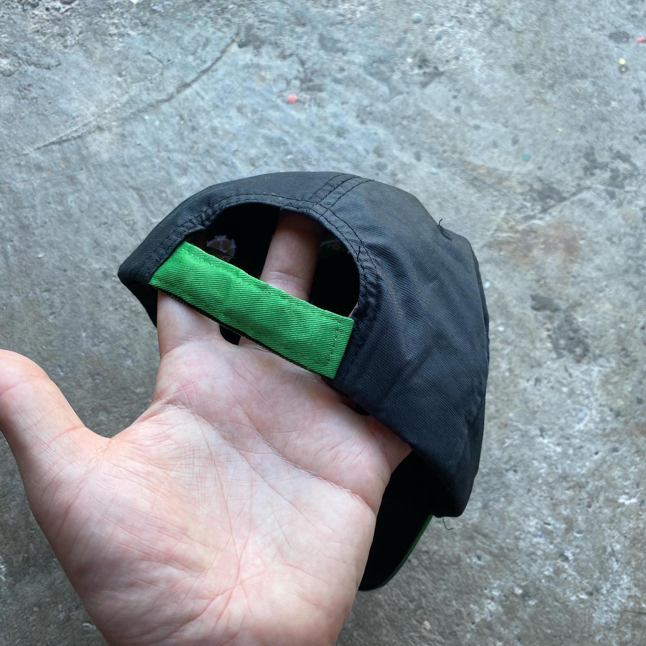 Black and green Heineken Champions League hat