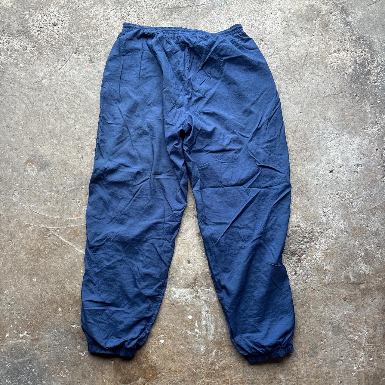 Navy Nike track pants with embroidered logo