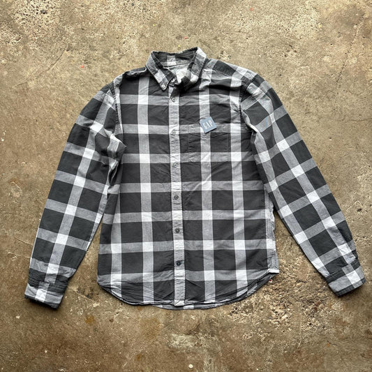 Black and grey Gap Oxford Shirt with workers tag on it