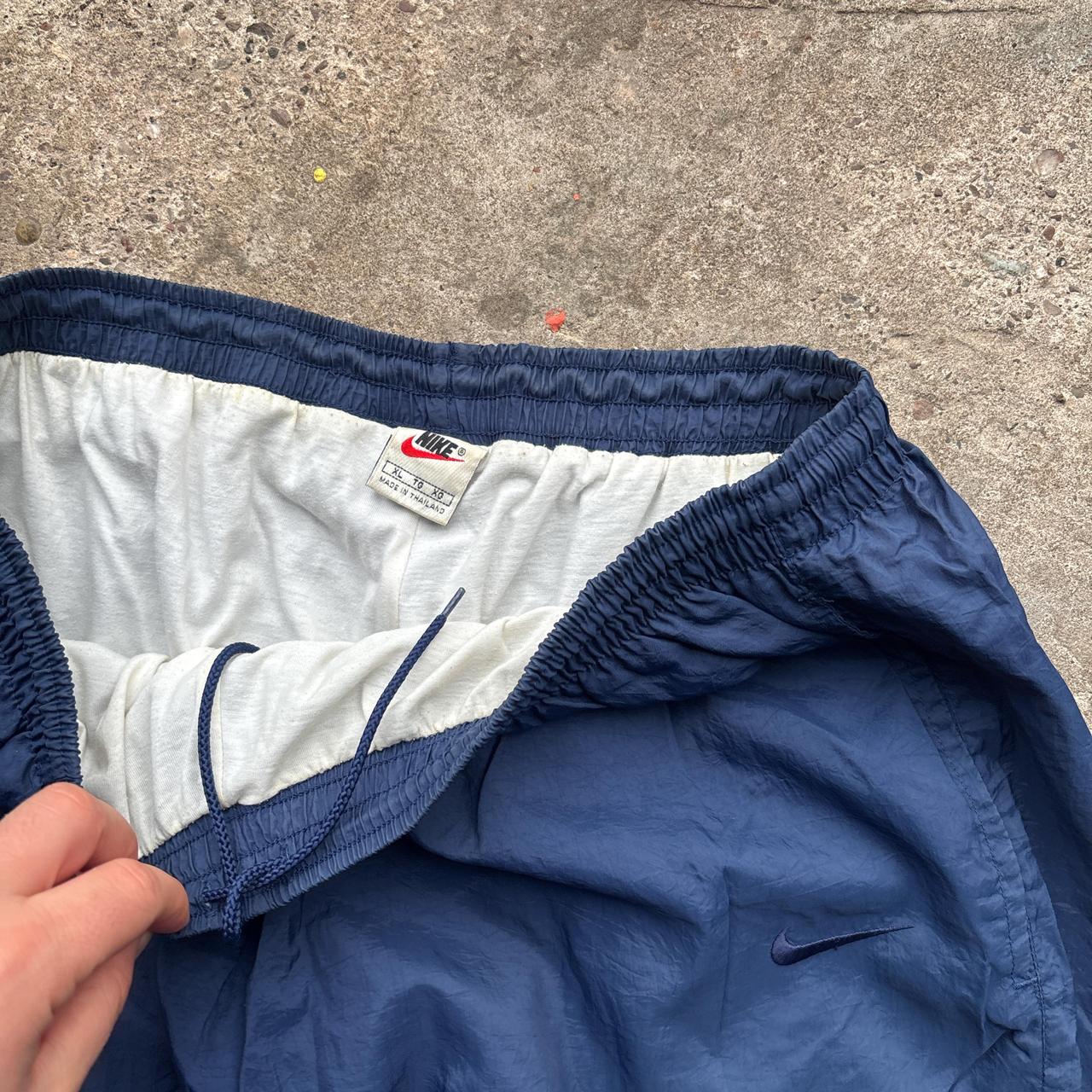 Navy Nike track pants with embroidered logo
