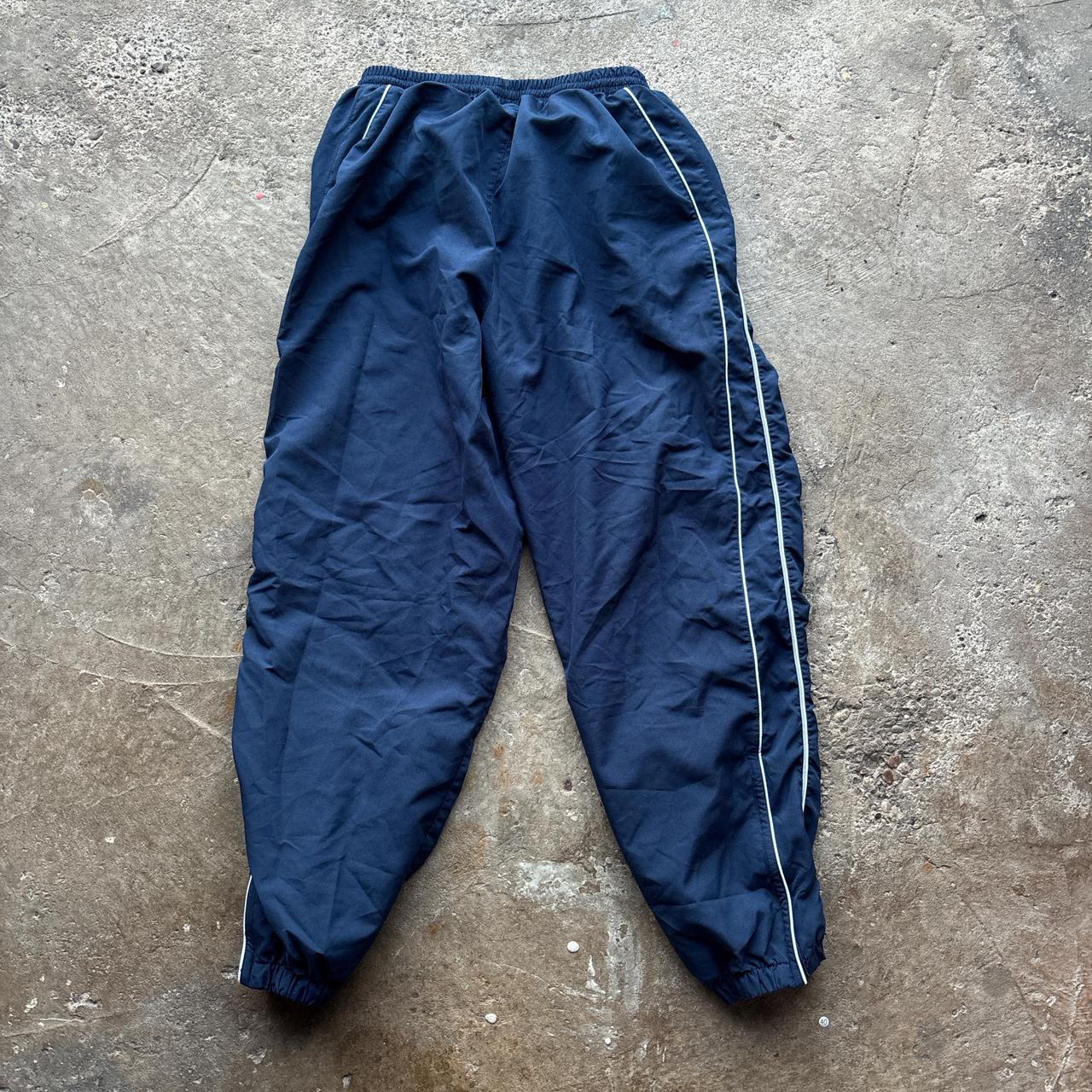 Navy Umbro joggers with white detailing