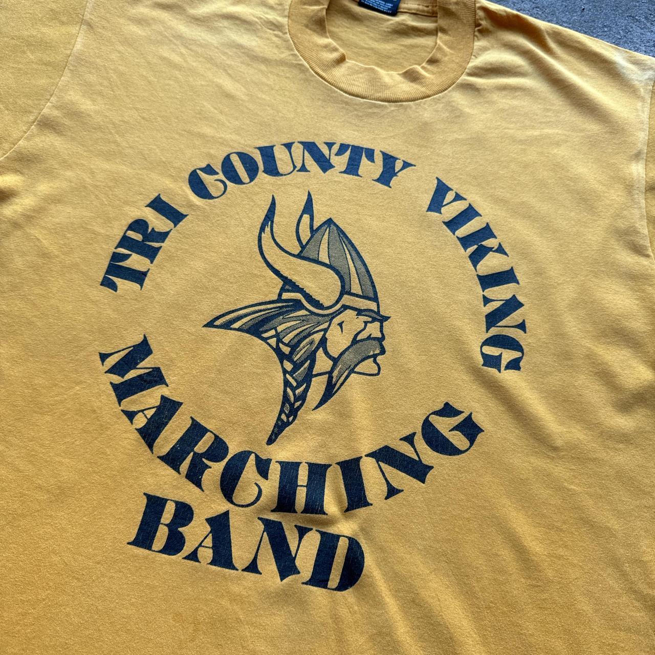 Yellow graphic tee with Viking marching band graphic