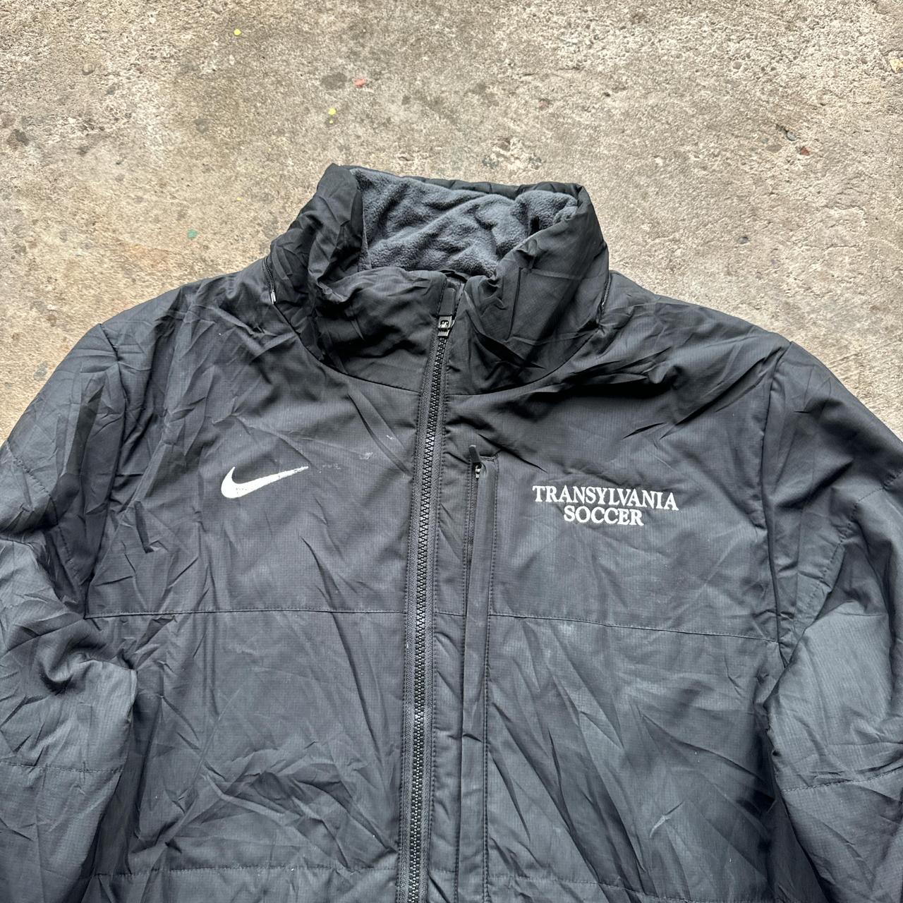 Black Nike puffer jacket with Transylvania Soccer embroidered logo
