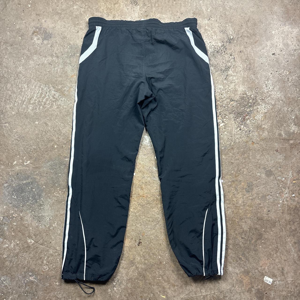 Black Adidas track pants