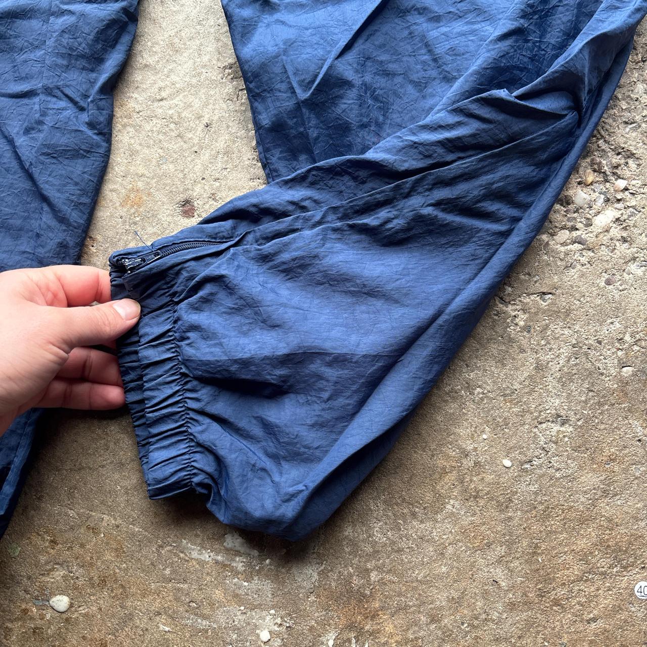 Navy Nike track pants with embroidered logo