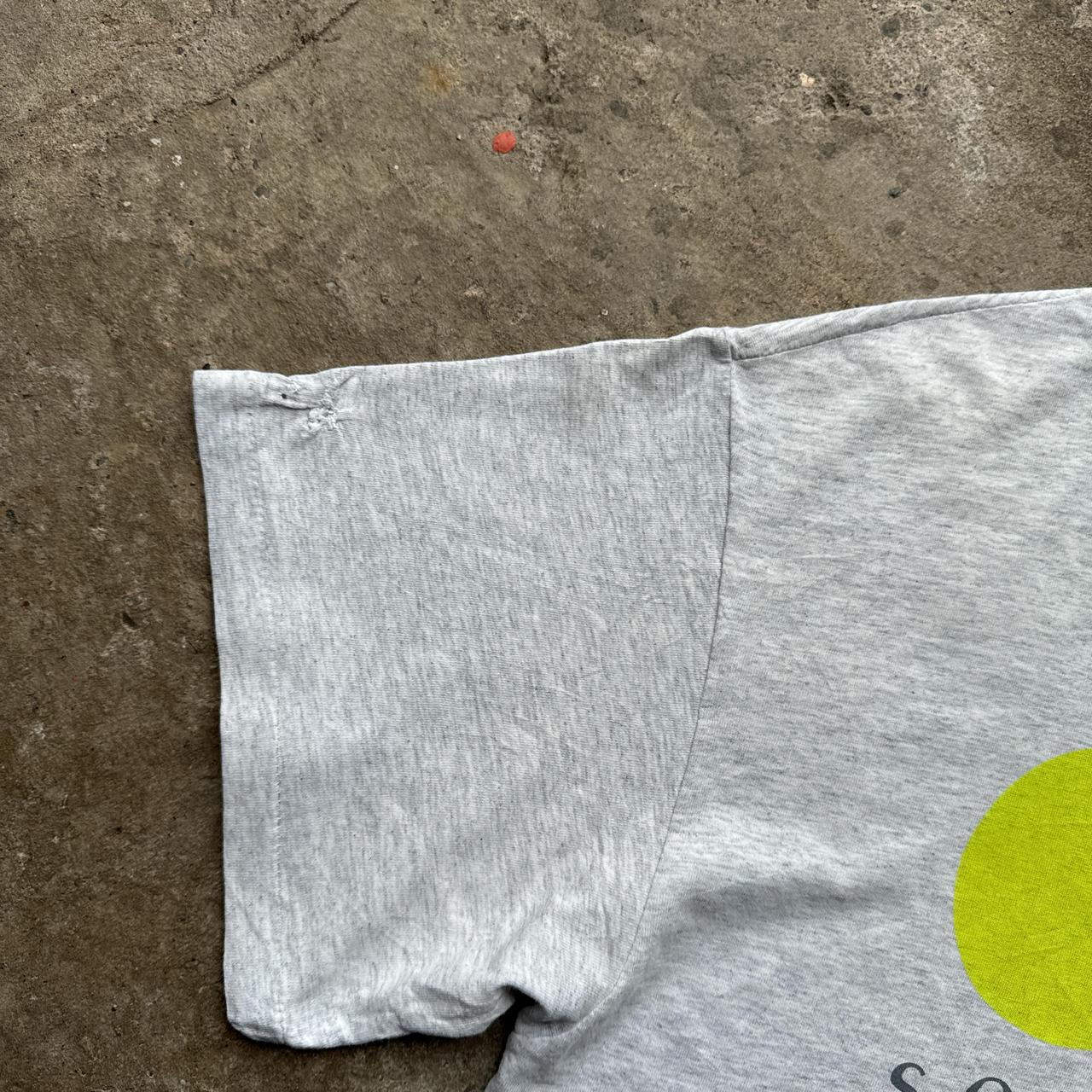 Grey graphic tee with “sorma” prints