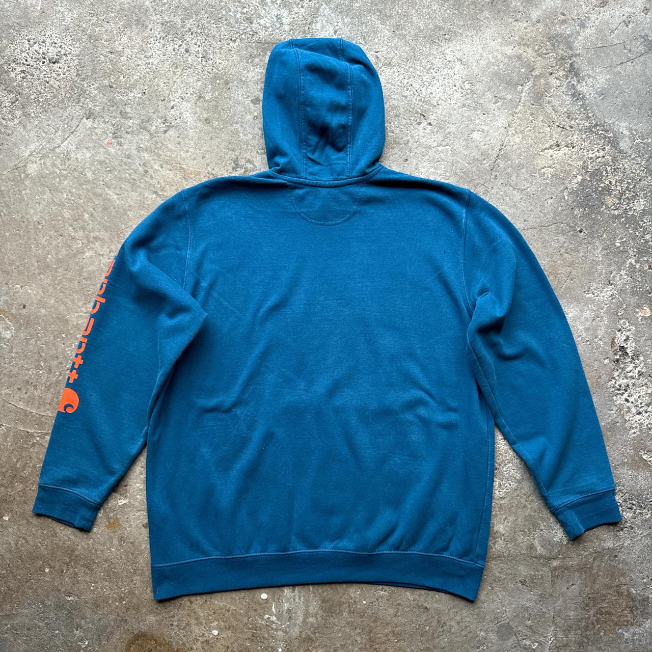 Blue Carhartt hoody with orange print down the sleeve