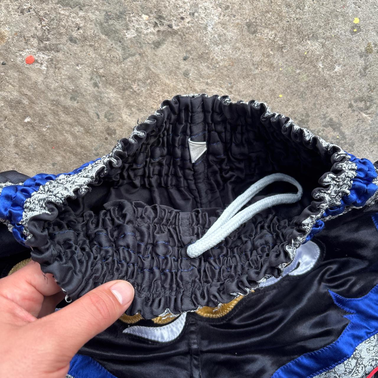 Black and blue Muay Thai shorts