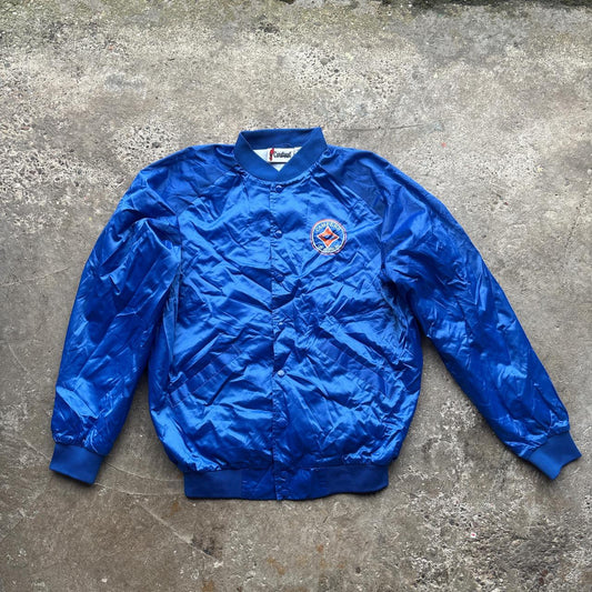 Blue Cardinal bomber jacket with ‘Campers on Mission’ logo
