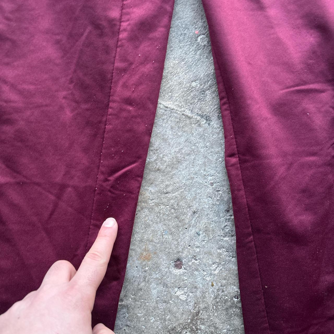 Burgundy Umbro sweatpants with stripe down the leg