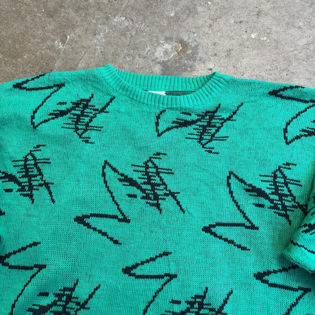 Green and black knitted sweater